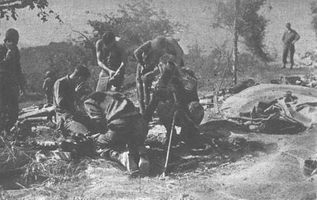 [A mortar crew fires another round against the Gothic Line]