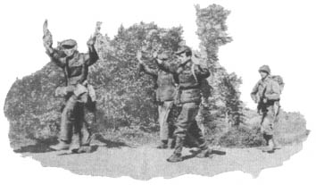 [Member of Co I 362nd Infantry marches three captured paratroopers back to the PW cage]