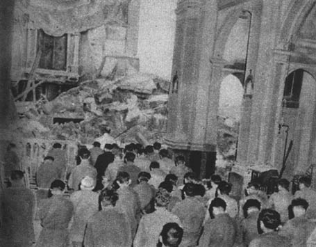 [Men of the 91st attend mass in a battered church near the front]