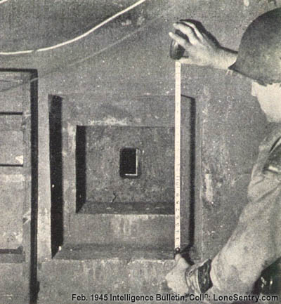 [View of an embrasure in the rear of a German pillbox used to protect the rear entrance from assault.]