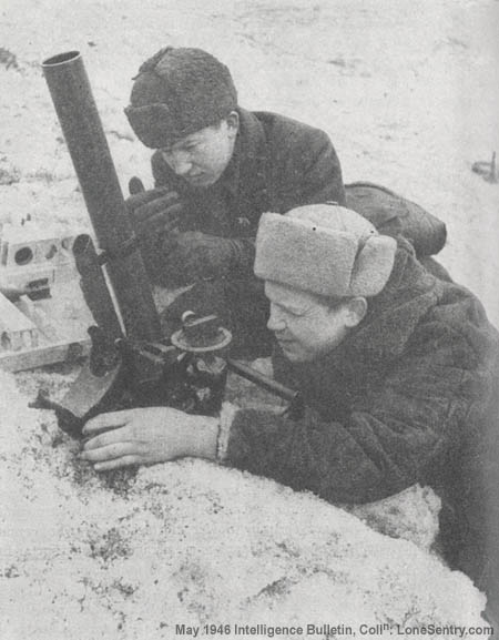 [The crew of an M1941 50-mm mortar go into action during one of the Red Army's winter offensives.]