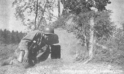 [This U. S. soldier is peering into an abandoned German pillbox.]