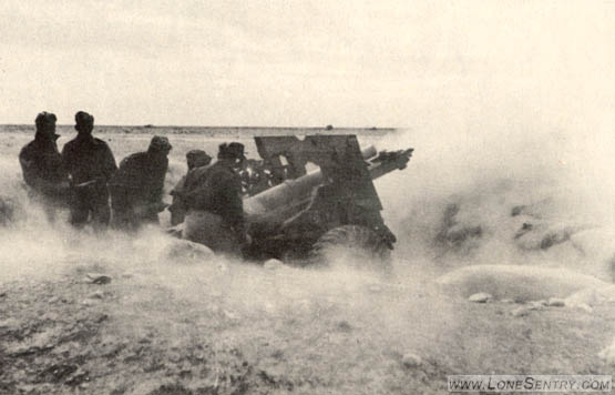 [Figure 7. British 25-pounder Firing in the Desert.]