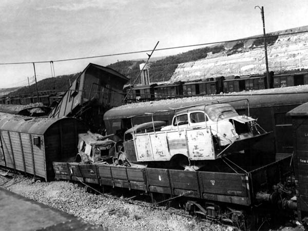 Car in Truck in Railroad Car: Littorio, Italy