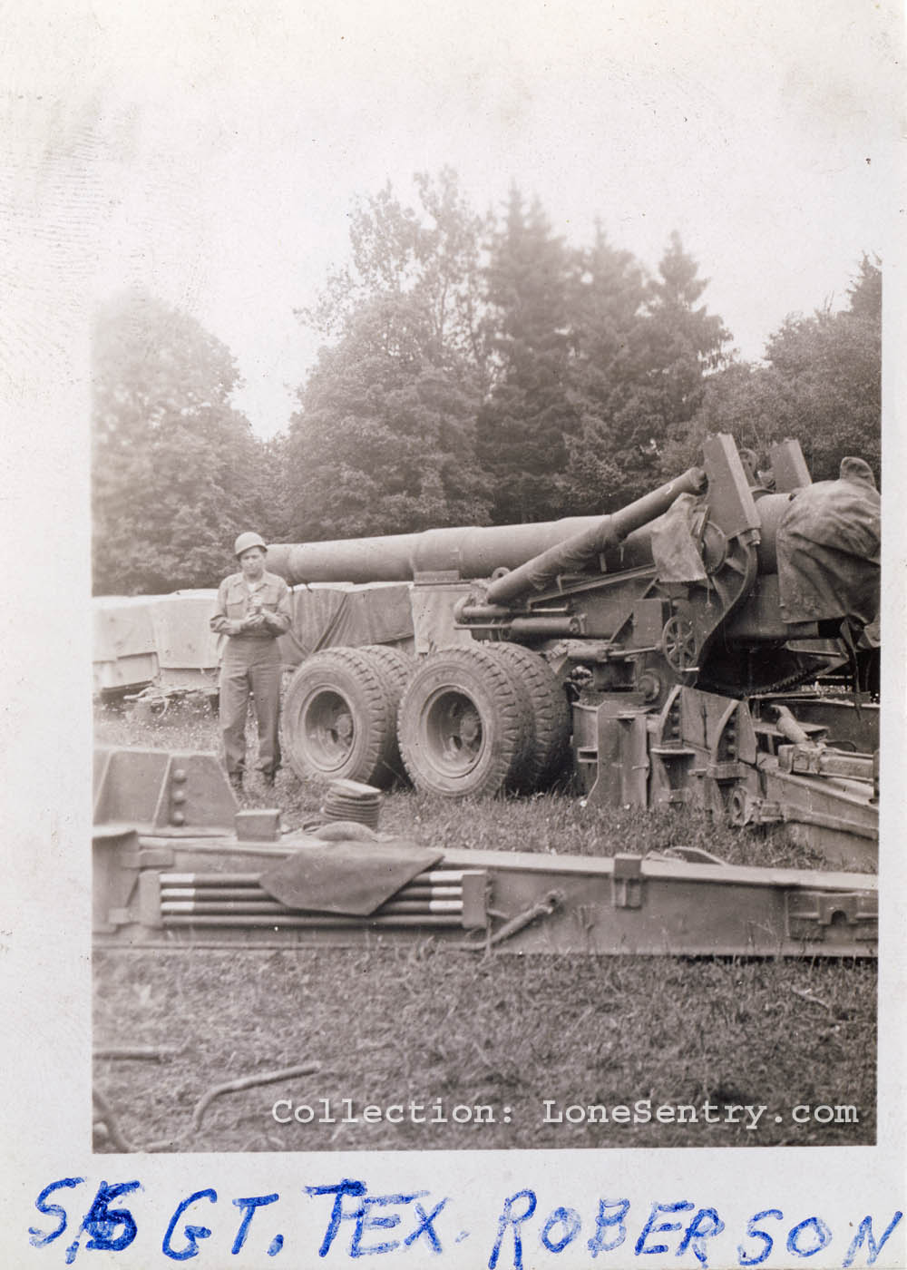 S/Sgt. Tex Roberson photographed with an 8-inch howitzer of the 995th Field Artillery Battalion.