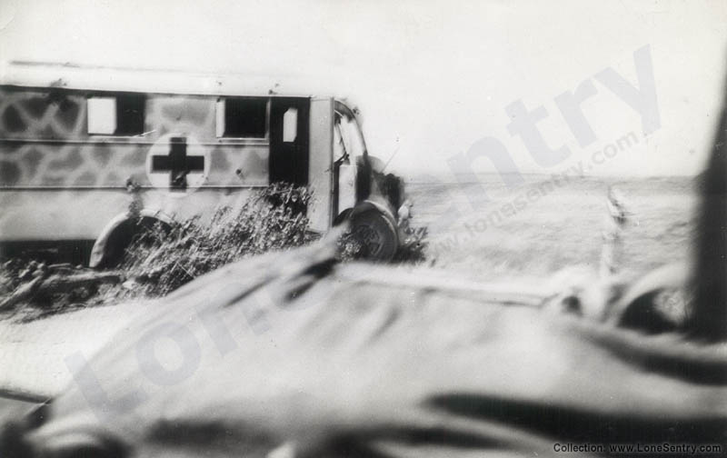 A destroyed medical vehicle of unknown type with an unusual camouflage scheme.