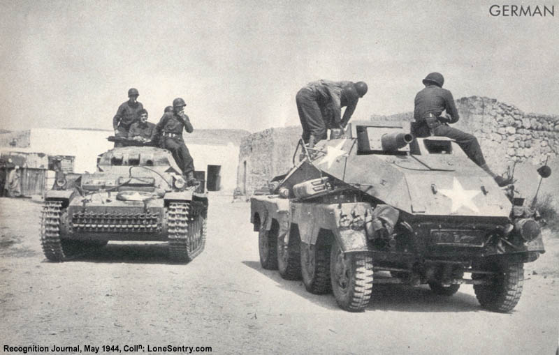 Captured Panzer II light tank and Sdkfz 233 8-wheeled armored car