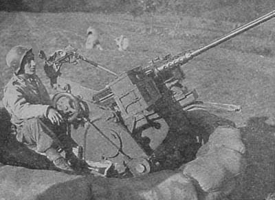 A German flak-wagon, mounting two captured American 50's, captured near Mortagne, France.