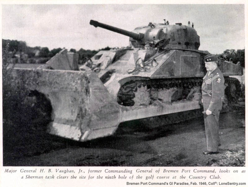 Major General H. B. Vaughan, Jr., former Commanding General of Bremen Port Command, looks on as a Sherman tank clears the site for the ninth hole of the golf course at the Country Club.