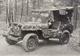 [FIGURE 36. Vehicle camouflaged with leaves applied with green-vegetation adhesive.]