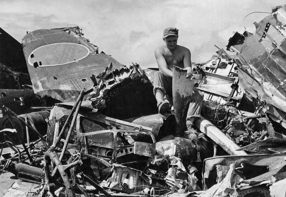 Souvenir hunting amid Japanese aircraft wreckage