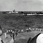 Two U.S. Navy aircraft carriers, USS Hornet (CV-12) and USS Independence (CVL-22), are photographed from the flight deck of the USS Wasp (CV-18) in January 1945.