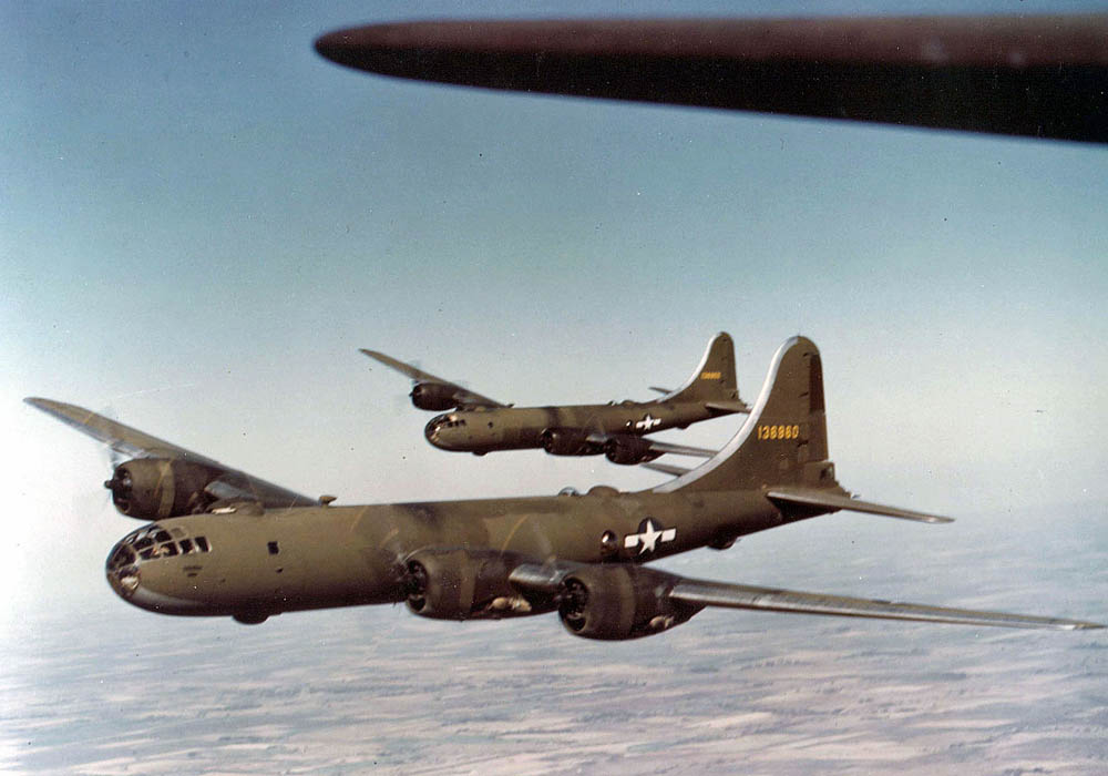 Color photo of two Being YB-29 Superfortress heavy bombers in flight. (U.S. Air Force Photograph.)