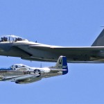 A North American P-51 Mustang flies in formation with an F-15E Strike Eagle during an air show in Milwaukee. (U.S. Air Force Photograph / MSgt. Kenneth Pagel.)