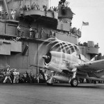 An F6F Hellcat's propeller blades leave a visible trail of condensation on the USS Yorktown. (U.S. Navy Photograph / NARA.)