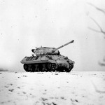 A snow-camouflaged M36 tank destroyer crosses a field near Dudelange, Luxembourg in January 1945. (U.S. Army Photograph.)
