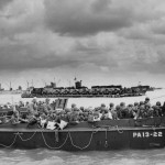 U.S. troops in an LCVP (Landing Craft, Vehicle, Personnel) prepare to land on Utah Beach on D-Day, June 6, 1944. The foreground LCVP was assigned to the U.S. Navy attack transport USS Joseph T. Dickman (APA-13). U.S. Army Photograph.