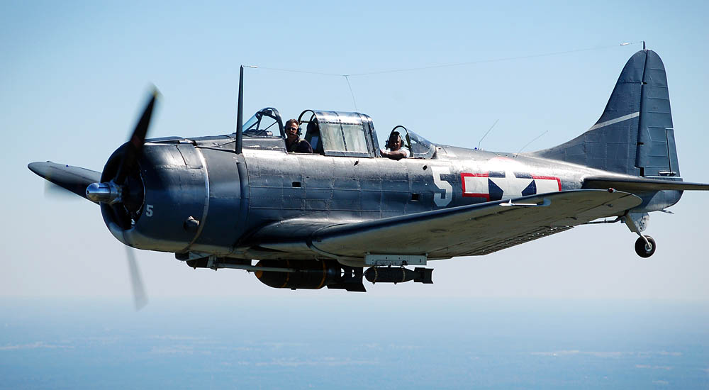 Original Caption: A vintage World War II aircraft, the SBD Dauntless, flies over Falcon Field during the Great Georgia Air Show as part of Air Force Week Atlanta Oct. 12 over Peachtree City, Ga. (U.S. Air Force Photograph / Tech. Sgt. Ben Gonzales.)