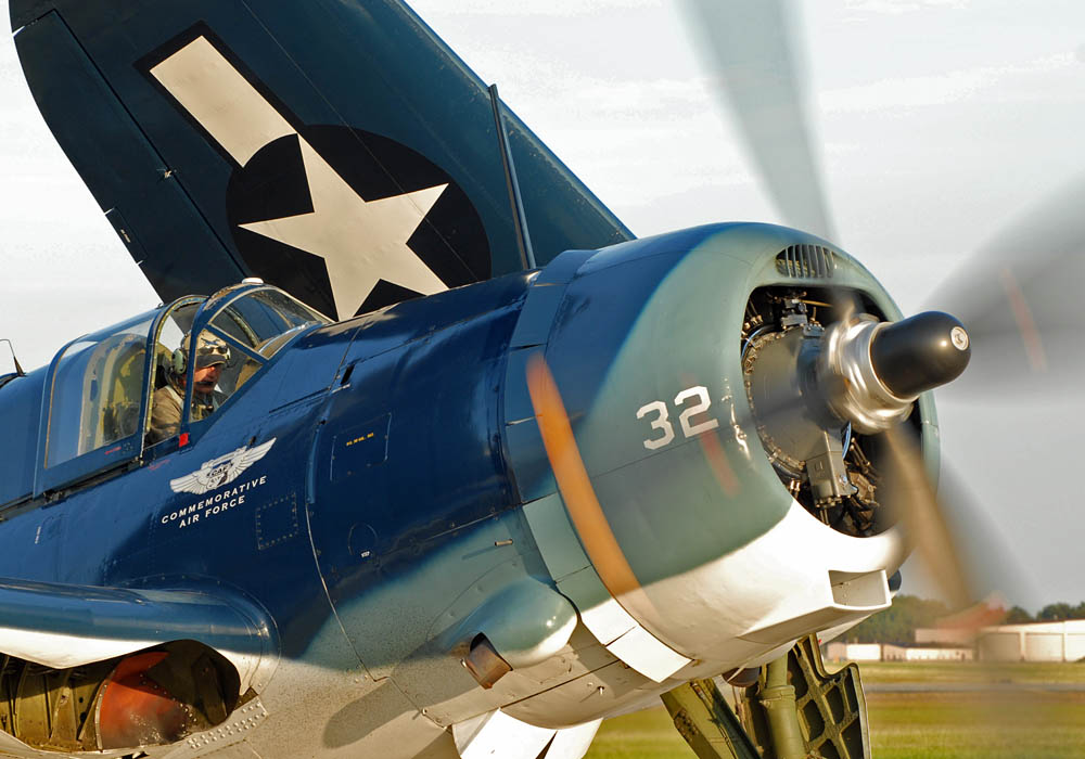 With the 1,900 horsepower Wright R-2600-20 Cyclone engine coming to life, Mr. Mark Allen, from Houston, Texas, prepares the last flying example of a Navy Curtiss-Wright SB2C Helldiver in the world before taking off Joint Base Andrews after completion of the Joint Service Open House.