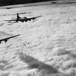 Boeing B-17 Flying Fortresses conduct a bombing mission through heavy clouds over Bremen, Germany in November 1943.