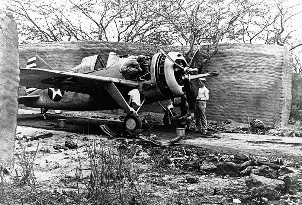 Brewster F2A-3 Buffalo fighter from Marine Fighting Squadron 212 (VMF-212) parked in a camouflaged revetment at Marine Corps Air Station Ewa, Hawaii in April 1942.