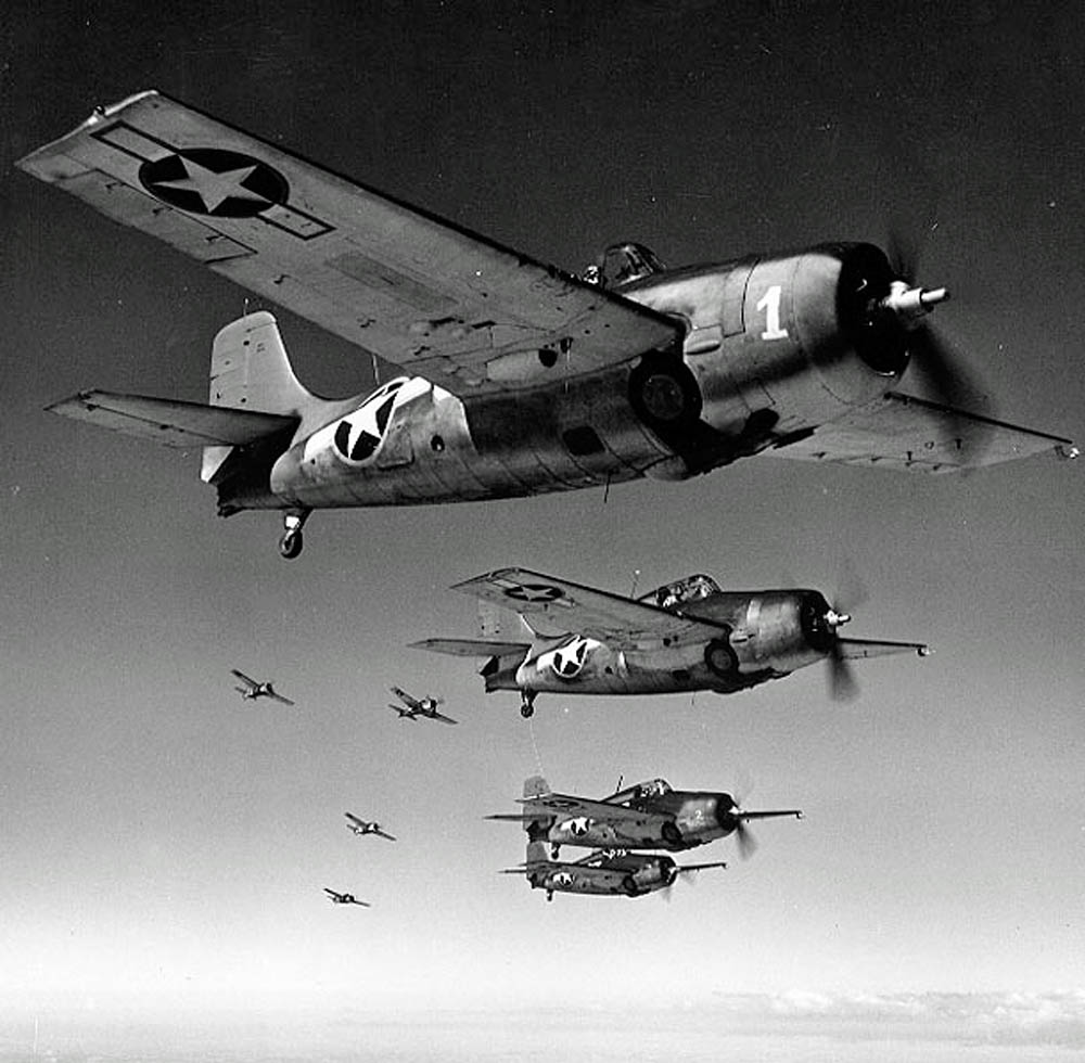 Grumman F4F Wildcat fighters of the U.S. Navy in formation over the Pacific during WWII.