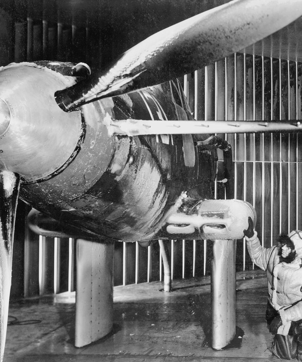 Ice on the fuselage and propellers of a test aircraft in the Icing Research Tunnel at the Aircraft Engine Research Laboratory of the National Advisory Committee for Aeronautics (NACA) in March 1945.