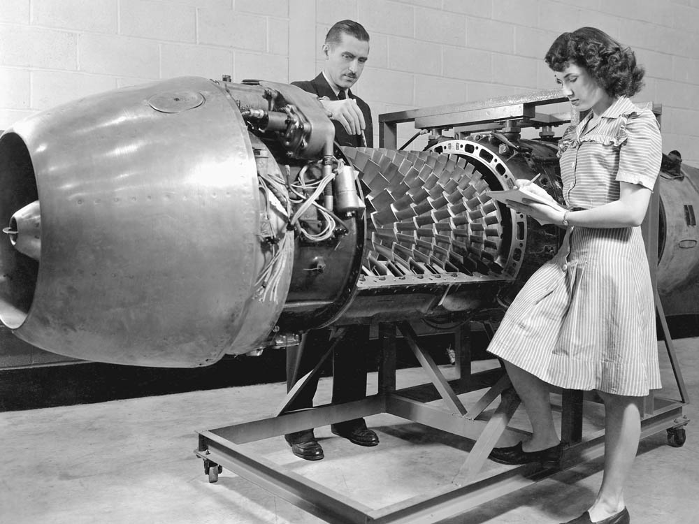 A German Jumo 004 engine with cover removed is inspected at the Aircraft Engine Research Laboratory of the National Advisory Committee for Aeronautics (NACA) in March 1946. (NASA Photograph.)