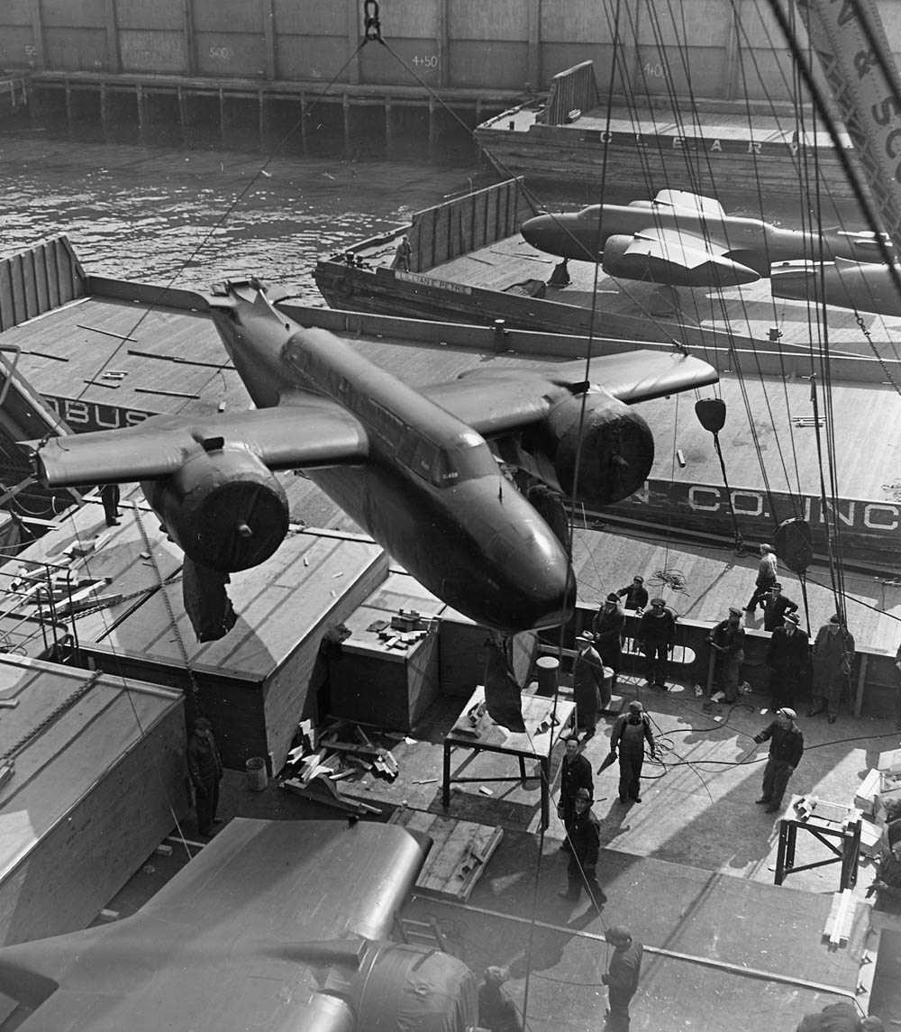 Douglas A-20 Havoc twin-engine bombers are loaded aboard a cargo ship to be provided to Allies under Lend-Lease. (U.S. National Archives and Records Administration.)