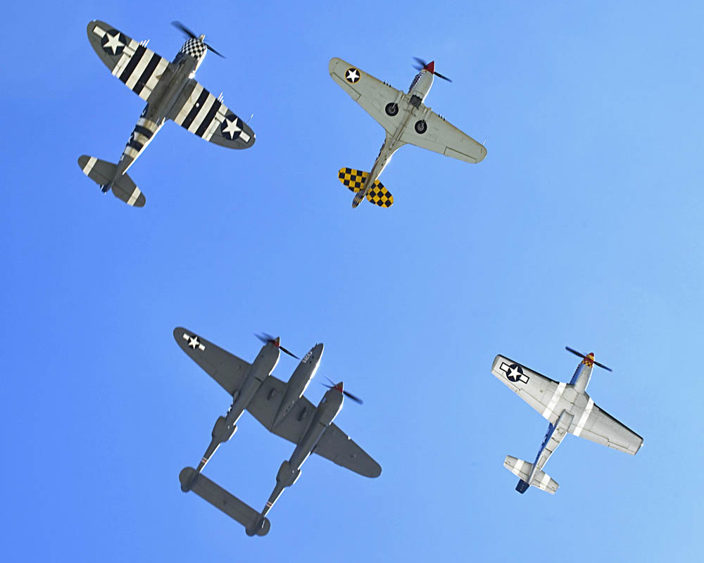 Heritage Flight 2015: A P-47 Thunderbolt, P-40 Warhawk, P-38 Lightning and P-51 Mustang fly in formation during the 2015 Heritage Flight Training and Certification Course at Davis-Monthan Air Force Base Ariz., March 1, 2015.