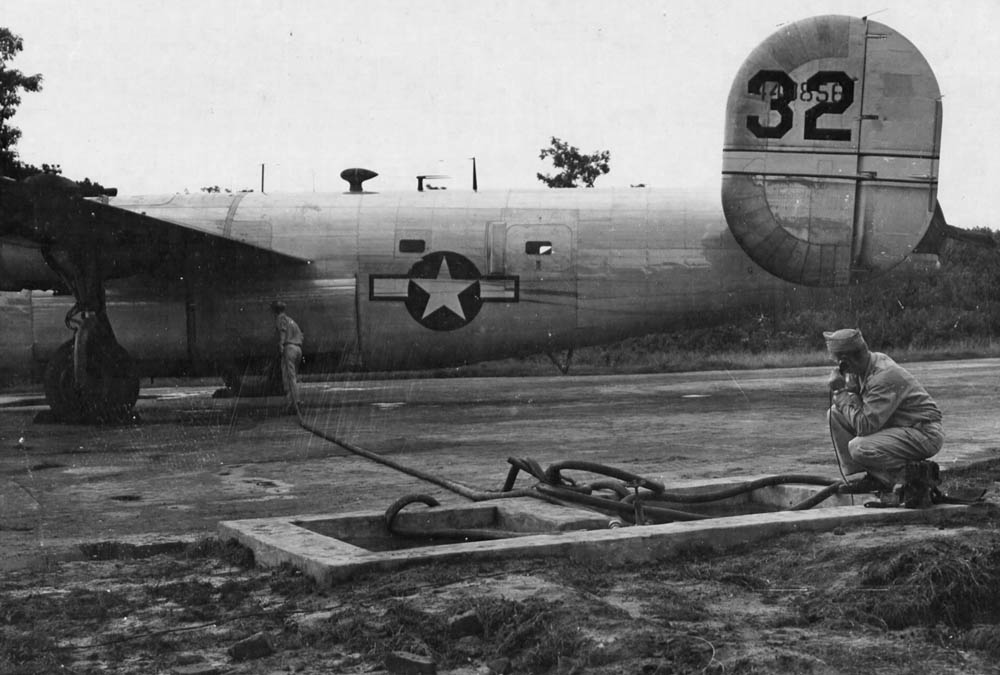 After being transported by rail & barge from Budge Budge, India, gasoline was then transported by Consolidated C-109's of the 7th Bomb Group, 10th Air Force from Kurmitola, India to Kunming, China. Here a C-109 is being loaded directly from a gasoline revetment outlet at Kurmitola, India. 6 September 1944.