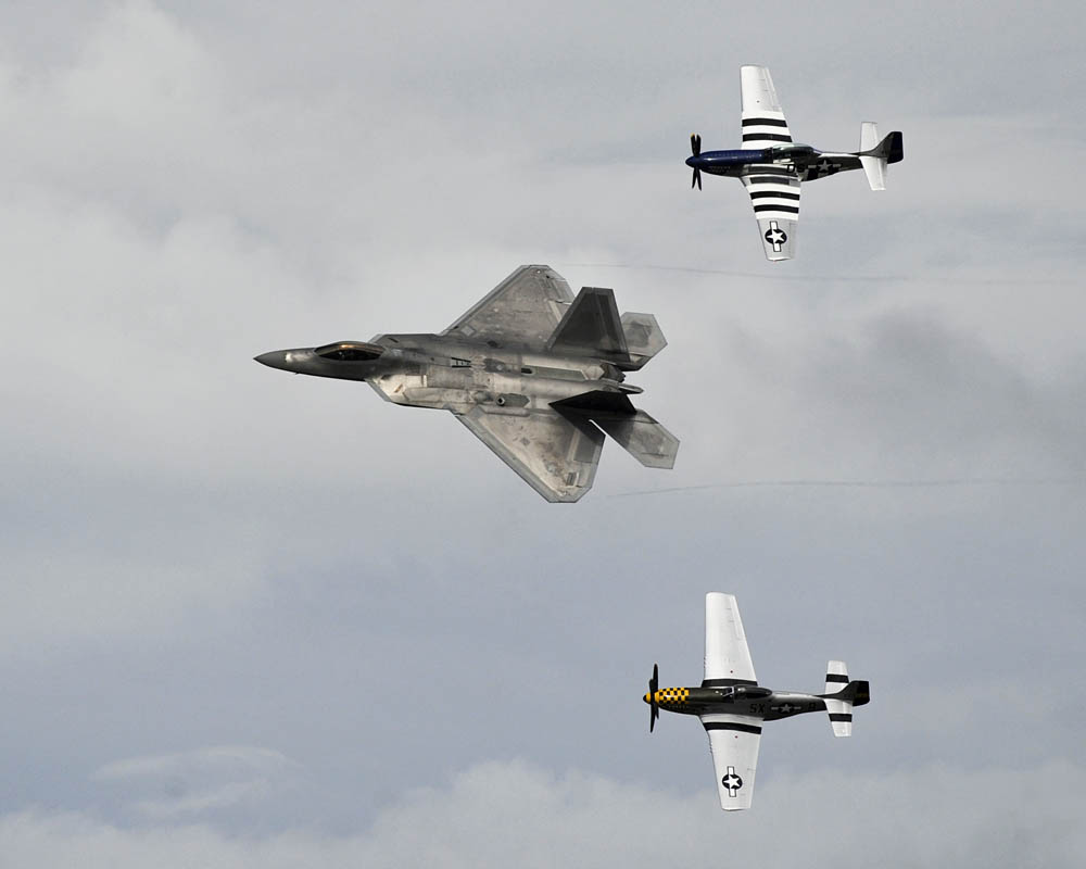 A F-22 Raptor leads a heritage flight at the Gulf Coast Salute open house and air show April 11, over Tyndall Air Force Base. The air show and open house featured the Air Force Thunderbirds, the F-22 Raptor demo team and the Army Golden Knights. (U.S. Air Force Photo by Senior Airman Alex Echols.)