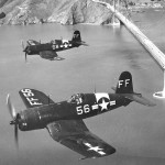 A pair of Goodyear FG-1D Corsairs flying over the Golden Gate Bridge in San Francisco.
