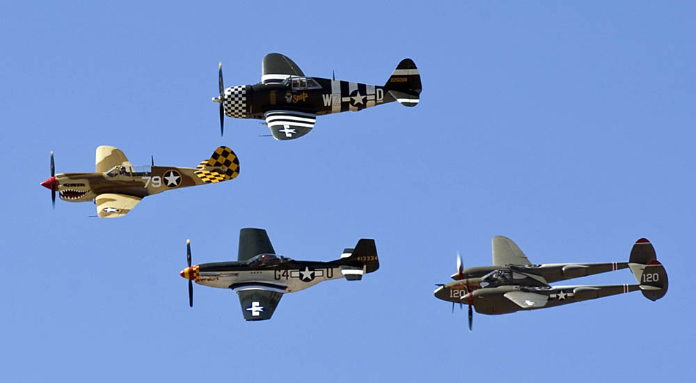 A P-40 Warhawk, P-51 Mustang, P-47 Thunderbolt and P-38 Lightning fly in formation during the 2015 Heritage Flight Training and Certification Course at Davis-Monthan Air Force Base Ariz., March 1, 2015. Established in 1997, the HFTCC featured aerial demonstrations from historical and modern fighter aircraft which will fly in formation together during air shows across the country. (U.S. Air Force Photograph by Airman 1st Class Chris Drzazgowski / Released.)