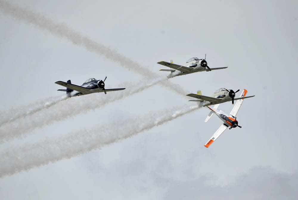 The Trojan Horsemen perform an aerial acrobatic demonstration during the Gulf Coast Salute open house and air show April 10, over Tyndall Air Force Base. The air show and open house featured the Air Force Thunderbirds, the F-22 Raptor demo team and the Army Golden Knights. (U.S. Air Force Photo by Airman First Class Sergio Gamboa.)