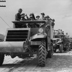 A column of halftracks waits for orders during training at Fort Knox, Kentucky in June 1942. (U.S. National Archives.)