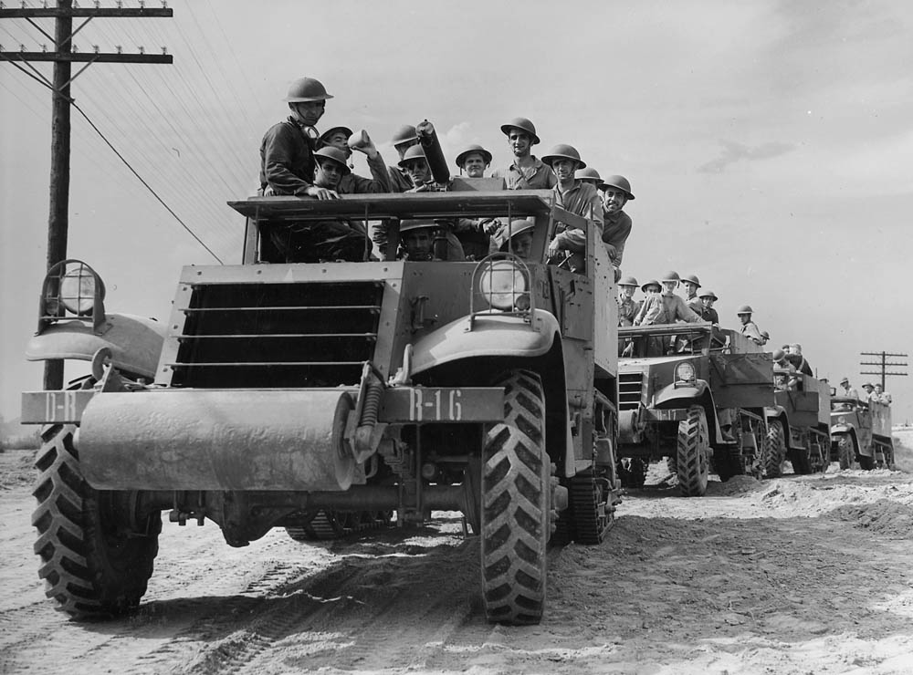 A column of halftracks waits for orders during training at Fort Knox, Kentucky in June 1942. (U.S. National Archives.)
