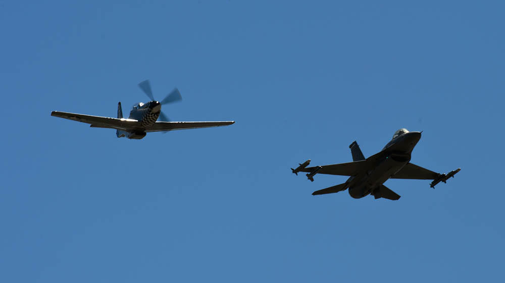 Original Caption: A F-16C Fighting Falcon, 457th Fighter Squadron, flies in formation with a P-51 Mustang over Naval Air Station Fort Worth Joint Reserve Base, Texas, Oct. 3, 2014. The 457th FS was activated on Oct. 4, 1944, and flew P-51's during World War II providing long-range support for bombers over Iwo Jima. (U.S. Air Force Photograph, Staff Sgt. Jonathan Snyder.)