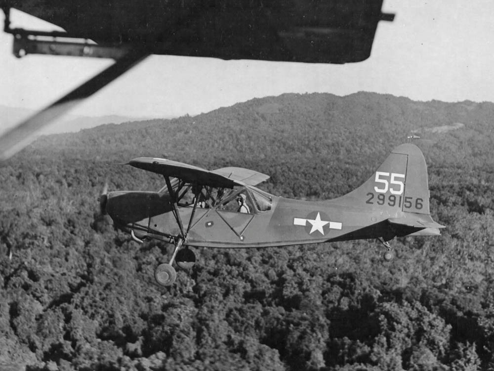 A Stinson L-5 Sentinel flies over Burma during WWII, December 1944. (U.S. Air Force Photograph.)