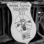 Insignia of U.S. Marine Fighting Squadron 217 (VMF-217) photographed on the front of a jeep on Bougainville, 1944. (U.S. National Archives Photograph.)