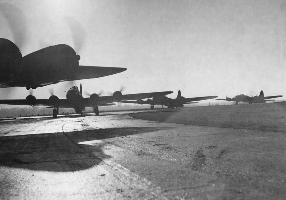 Boeing B-17 Flying Fortresses of the 8th Air Force prepare to takeoff from an air base in England on a bombing mission over Germany. (U.S. Air Force Photograph.)