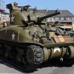 World War II reenactors make final preparation to drive their Sherman tank to a ceremony June 4, 2015, to commemorate the U.S. Army’s efforts to liberate Montebourg, France, after the D-Day landings.