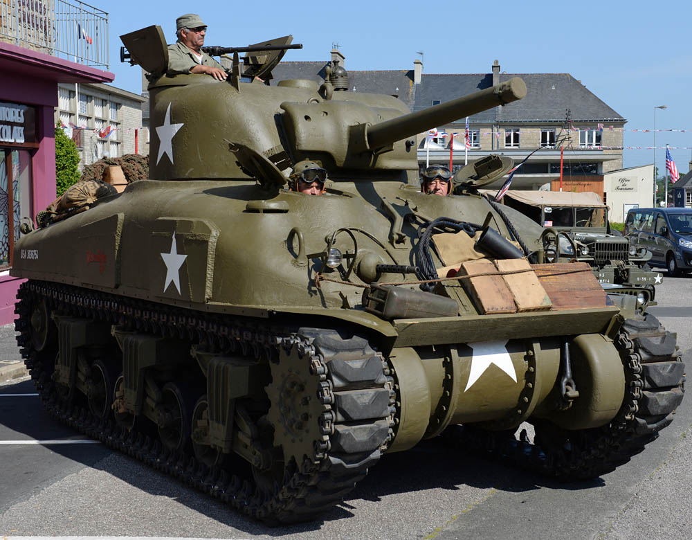 World War II reenactors make final preparation to drive their Sherman tank to a ceremony June 4, 2015, to commemorate the U.S. Army’s efforts to liberate Montebourg, France, after the D-Day landings.