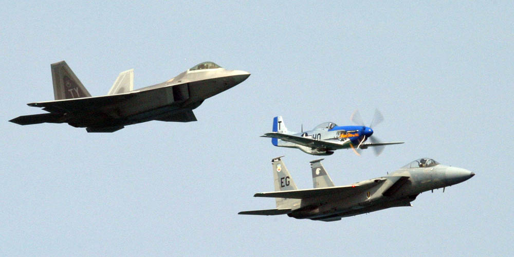 HERITAGE FLIGHT: An F-22A Raptor, a P-51 Mustang, and an F-15 Eagle fly in a heritage flight formation above Ft. Lauderdale, Fla., during the 2007 McDonald’s Air and Sea Show on May 6. The three jets represent three generations of the world’s most dominant fighter aircraft. (U.S. Air Force Photograph / Tech. Sgt. Paul Dean.)
