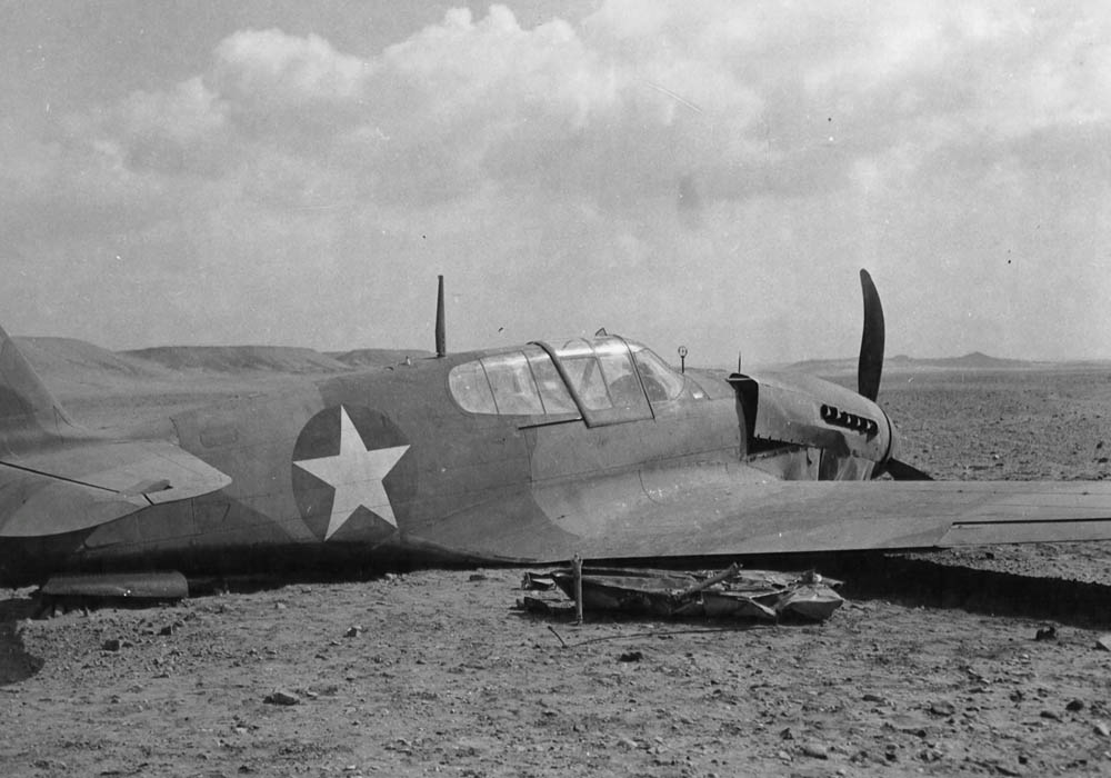 A wrecked Curtiss P-40 Warhawk after making a forced landing in Egypt, February 1943. (U.S. Air Force Photograph.)