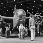 Factory workers pull a completed Douglas A-20 attack bomber off the assembly line at the Long Beach manufacturing plant, October 1942. (U.S. National Archives and Records Administration Photograph.)