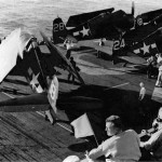 Prior to the invasion of Southern France, U.S. Navy Grumman F6F-5 Hellcat of Fighting Squadron 74 (VF-74) are parked on the deck of the escort carrier USS Kasaan Bay (CVE-69), August 1944. (U.S. Navy Photograph.)