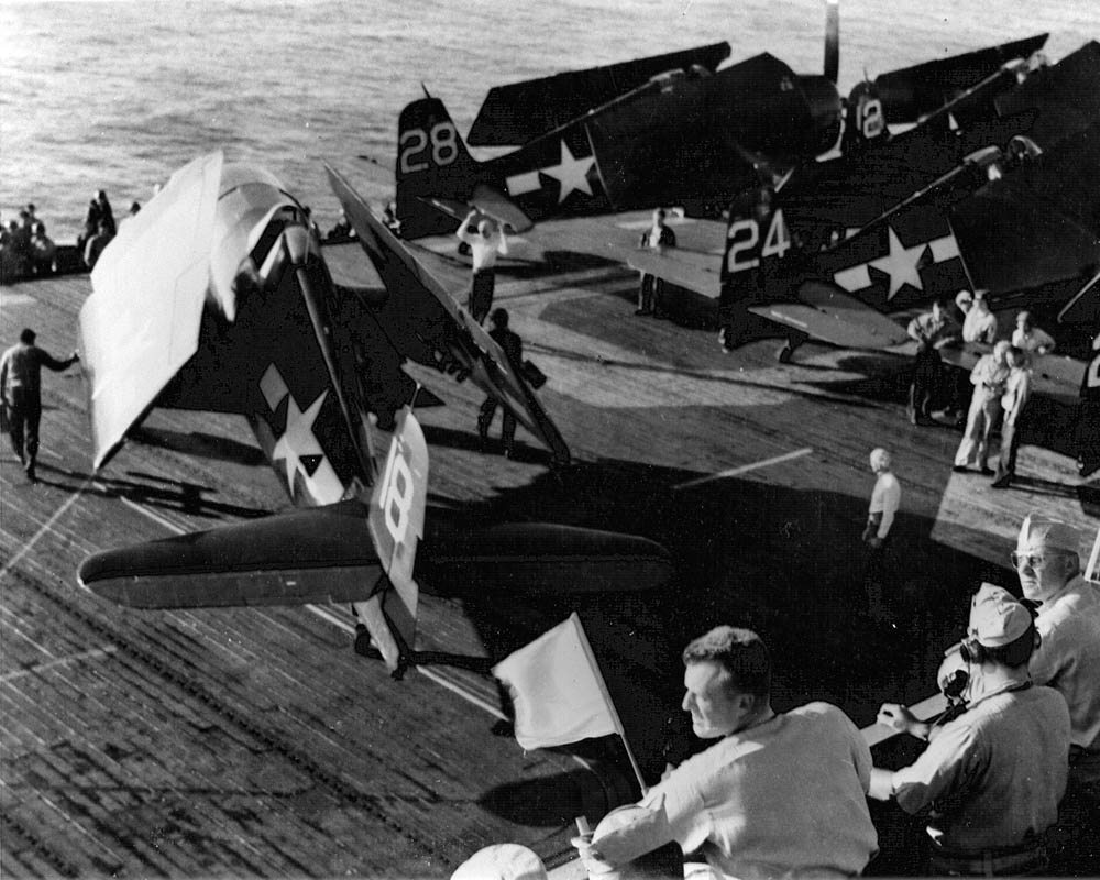 Prior to the invasion of Southern France, U.S. Navy Grumman F6F-5 Hellcat of Fighting Squadron 74 (VF-74) are parked on the deck of the escort carrier USS Kasaan Bay (CVE-69), August 1944. (U.S. Navy Photograph.)