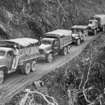 U.S. trucks wind along the Ledo supply road from India to Burma. (National Archives Photograph.)