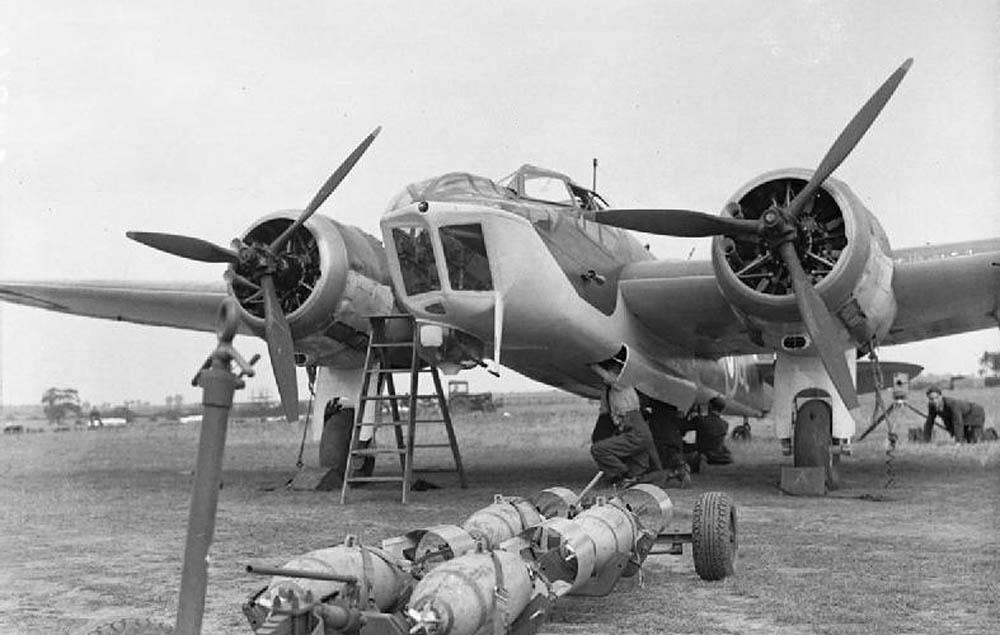 Ordnance is loaded on an RAF Bristol Blenheim Mark IV of No. 40 Squadron at Wyton, Cambridgeshire. (Imperial War Museum Photograph.)